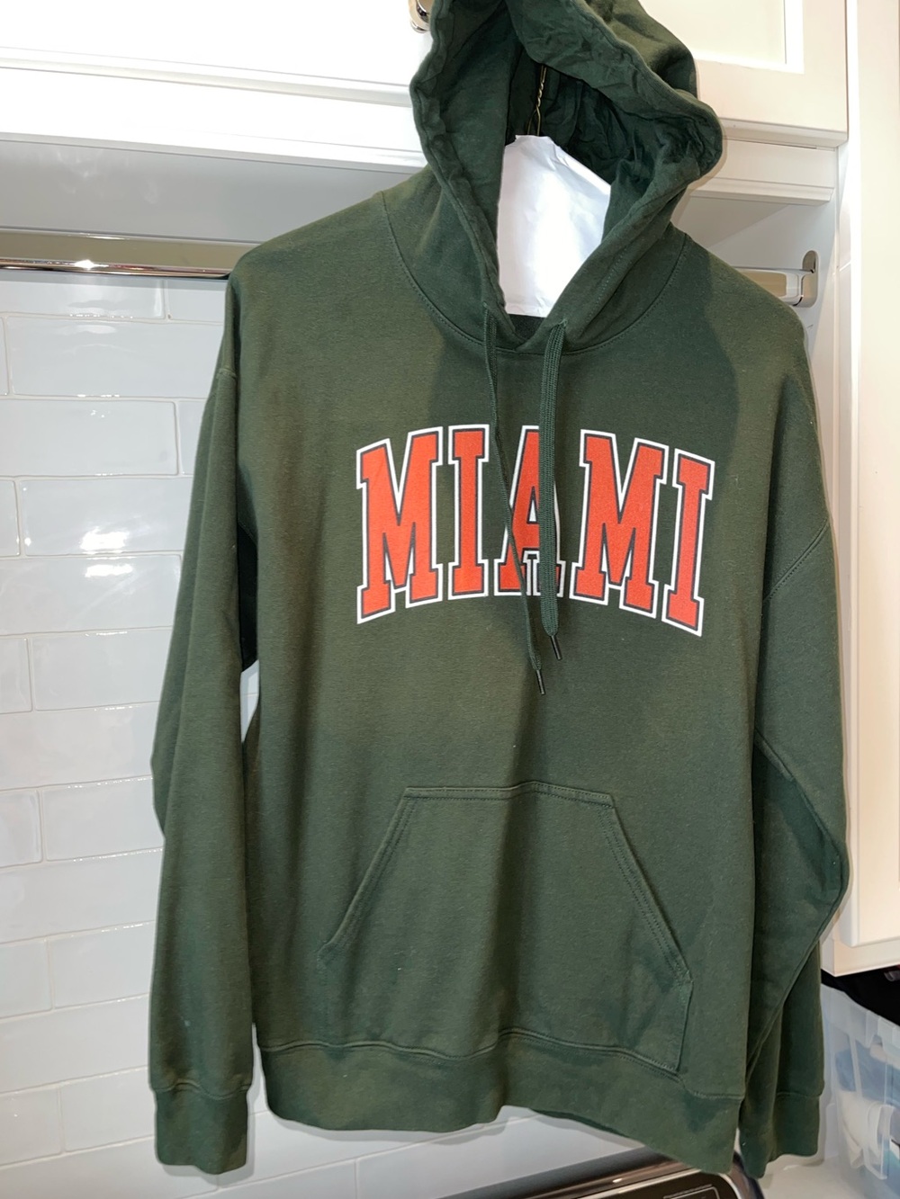 Univ of Miami green hooded Gildan sweatshirt